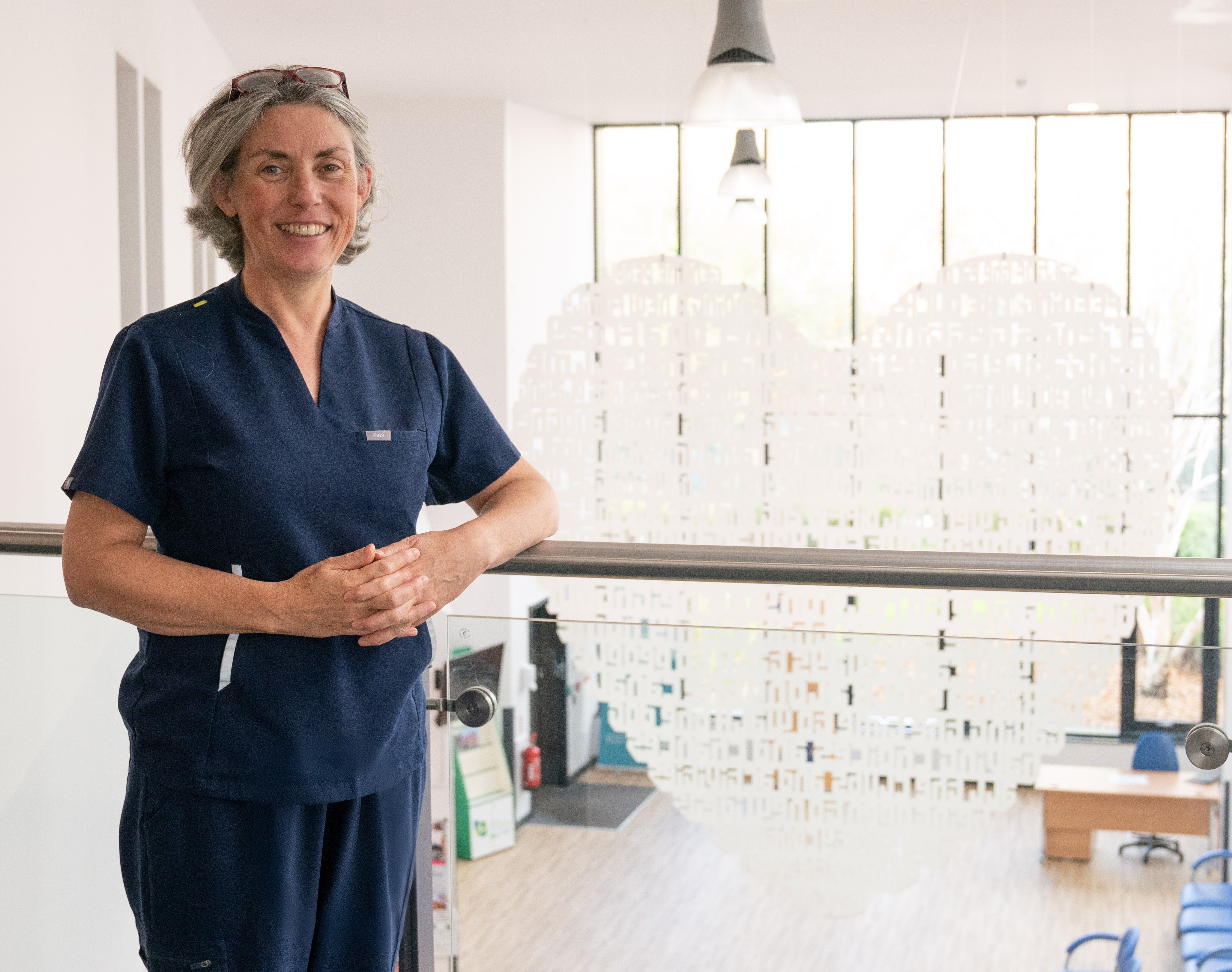 Photo of Dr Ruth wearing scrubs